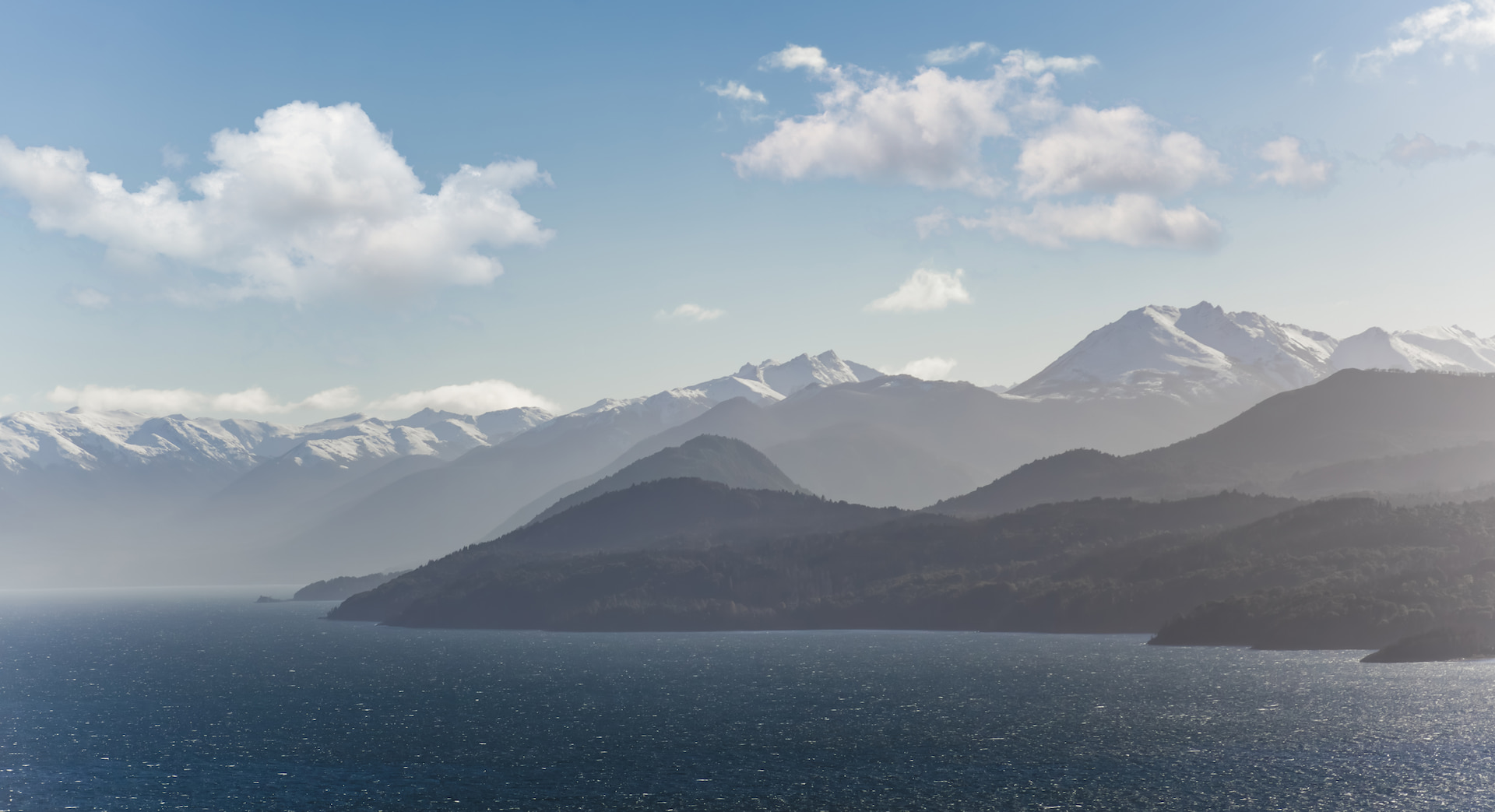 Panoramic view of Nahuel Huapi Lake and snow-capped Andes mountains seen from Villa Beluno luxury hotel in Bariloche, Patagonia